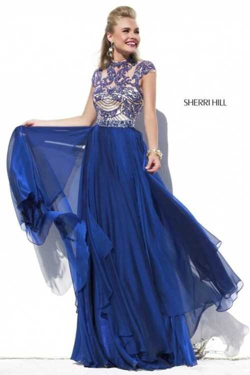 Взять в прокат Женская одежда Платья SHERRI HILL SH037 Москва Взять в прокат Женская одежда Платья SHERRI HILL SH037; Москва , г.Москва, Малый Конюшковский переулок, дом 2 (Галерея MOD DESIGN) ул.; Описание: Назначение: выпускной бал, венский бал, последний звонок, романтический вечер, студийная или выездная фотосессия, новогоднее торжество, корпоративная вечеринка, празднование дня рождения.
Описание модели: вечернее платье в пол, с многослойной юбкой из шифона и небольшим шлейфом. Верх платья изящно расшит стеклярусом, бисером, пайетками и стразами на тонкой сетчатой ткани. Внутренняя подкладка выполнена из атласа телесного цвета. Лиф с чашечками. Фасон данной модели выполнен "под горло" и прикрывает плечи. Спина открыта.