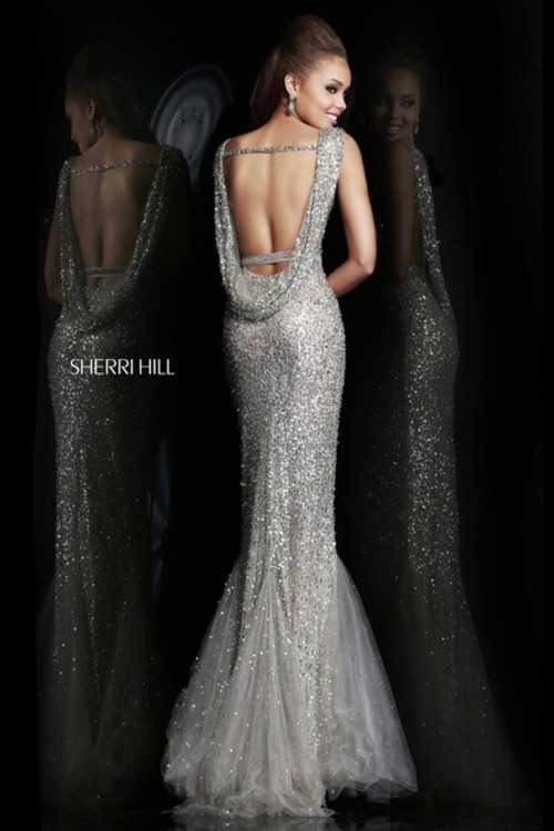 Взять в прокат Женская одежда Платья SHERRI HILL SH034 Москва Взять в прокат Женская одежда Платья SHERRI HILL SH034; Москва , г.Москва, Малый Конюшковский переулок, дом 2 (Галерея MOD DESIGN) ул.; Описание: Назначение: выпускной бал, романтический вечер, студийная или выездная фотосессия, новогоднее торжество, корпоративная вечеринка, празднование дня рождения, свадебная церемония.
Описание модели: эффектное, вечернее платье в пол фасона "годе". Выполнено из сетчатой ткани, полностью расшито пайетками. Изнутри атласная подкладка. Лиф с чашечками. Платье украшено тонким поясом со стразами. Спина открыта. Юбка имеет небольшой шлейф.